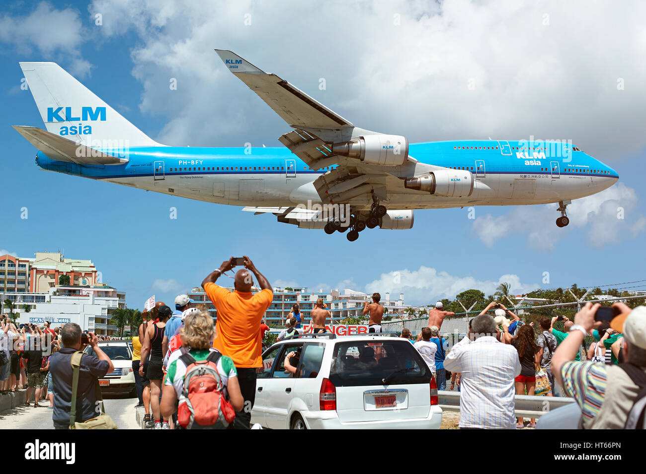 St. Maarten, Philipsburg island - March 17, 2015: Big plane landing under heads of people in famous caribbean st. maarten beach Stock Photo