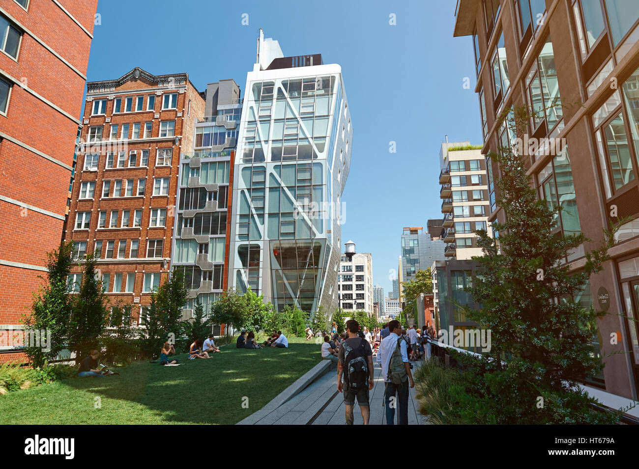 New York, Nicaragua - August 12, 2012: Building in highline park in New York city. People walking on urban park on sunny day. Eco city building Stock Photo