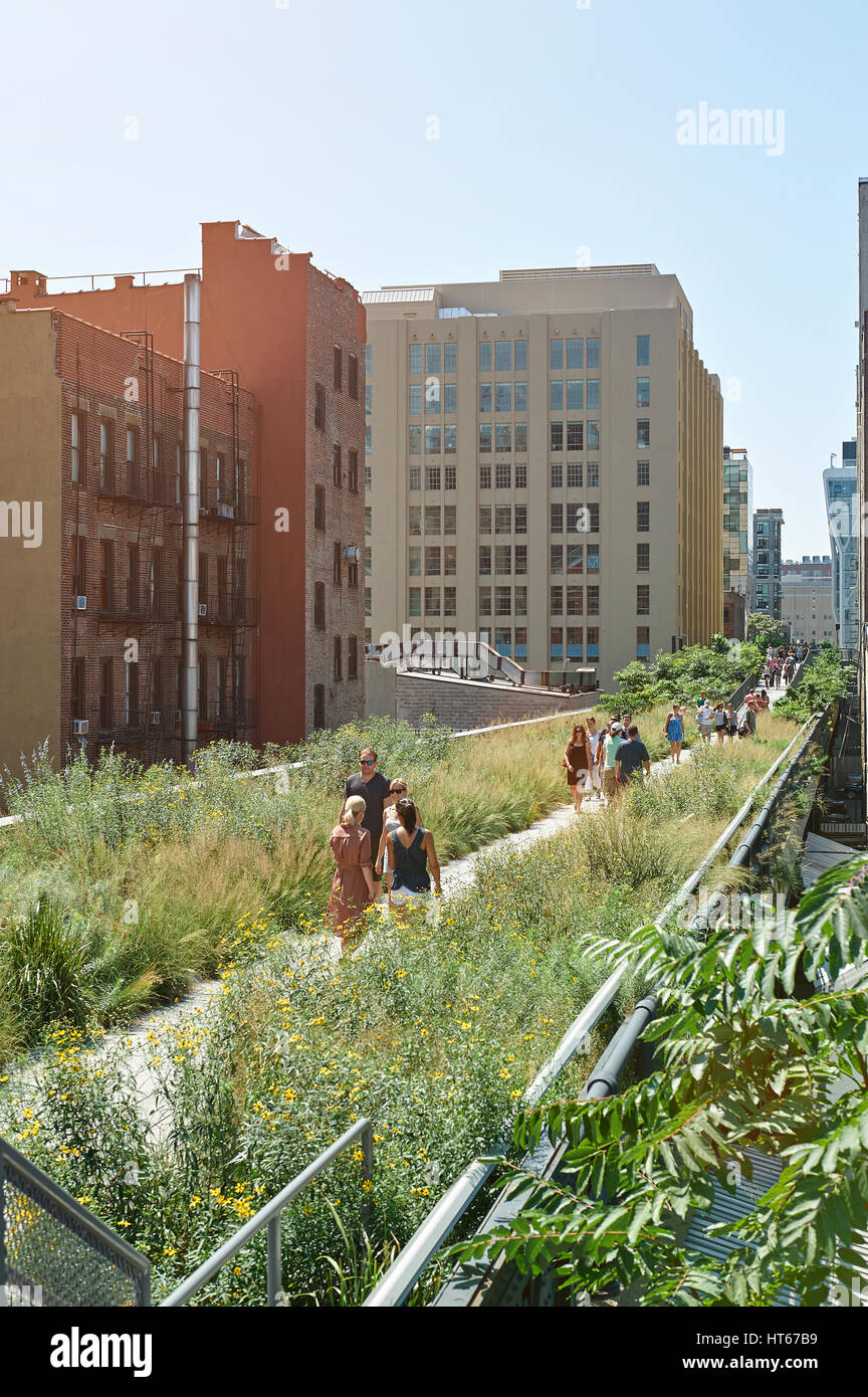New York, USA - August 12, 2012: Green highline park in New York city. People walking on urban park on sunny day Stock Photo