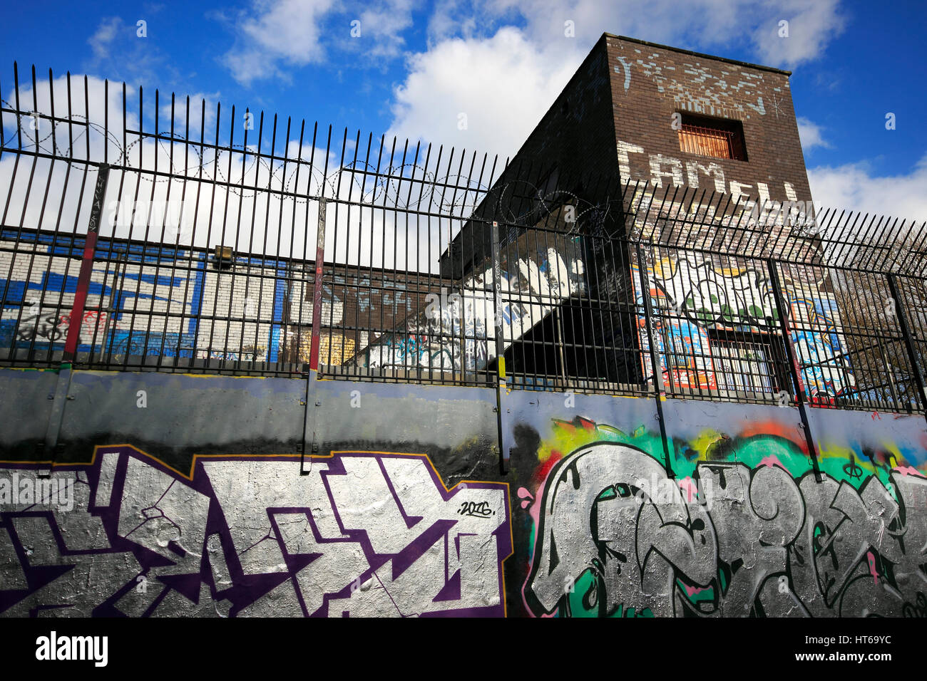 Colourful graffiti on a wall, sewage treatment building, Chorlton Ees, Manchester, UK Stock Photo