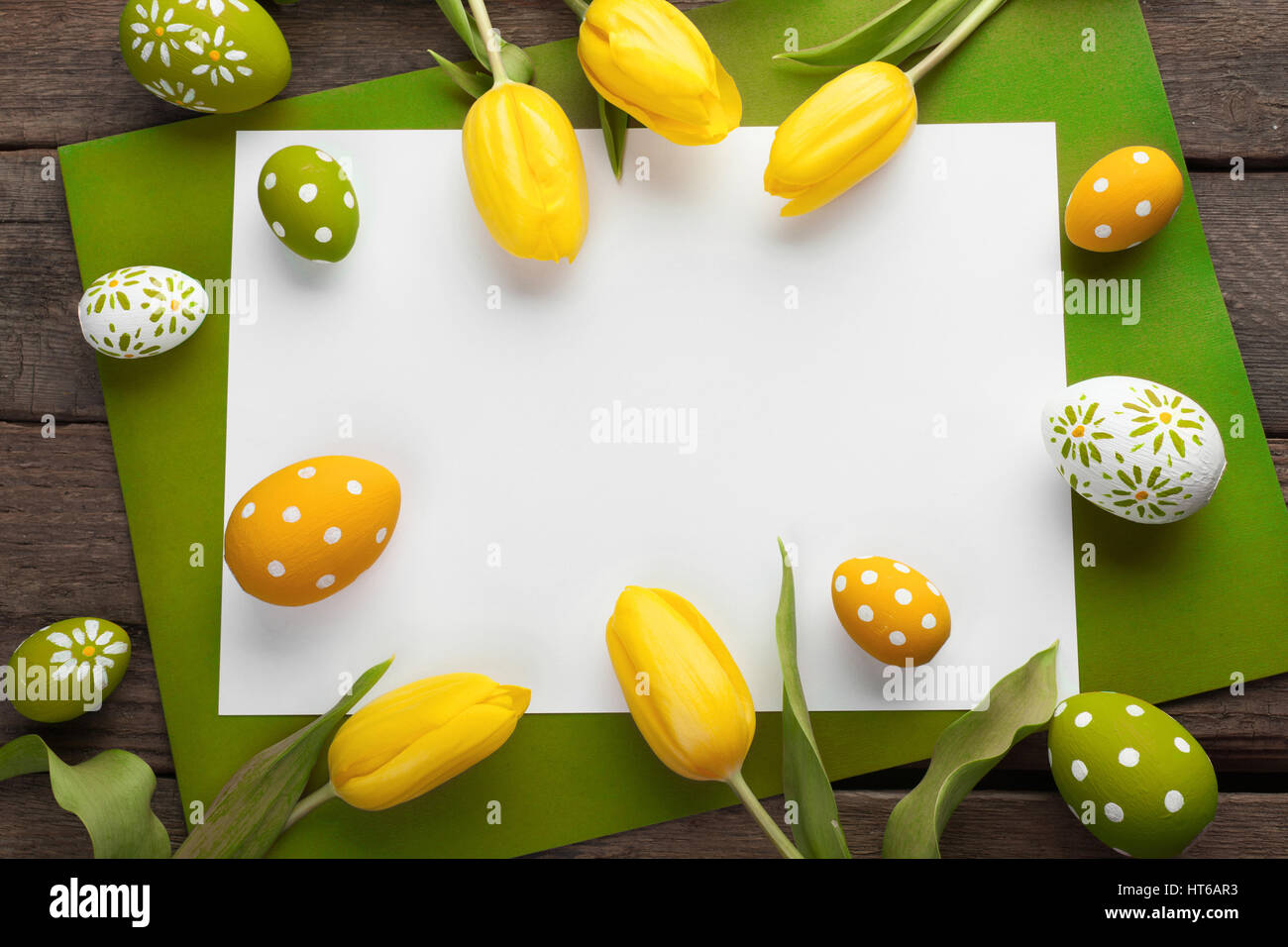 Easter background with colorful eggs over white wood Stock Photo - Alamy