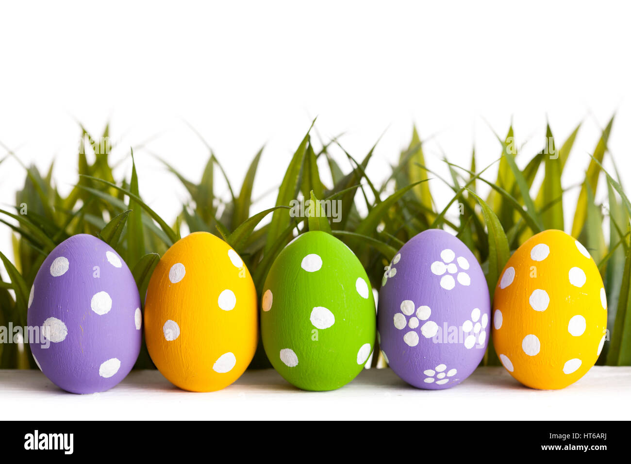 Easter colored eggs on the green grass. studio shot Stock Photo