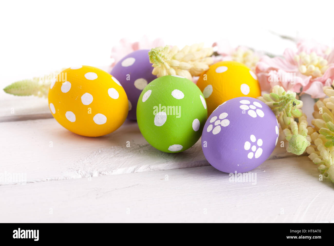 Easter Eggs with Spring Flowers. studio shot Stock Photo