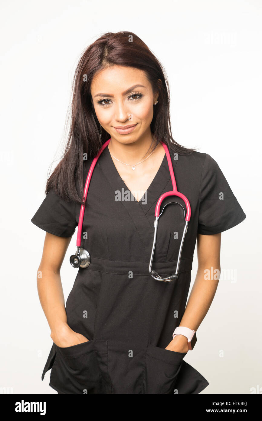 Young nurse in scrubs wearing stethoscope Stock Photo