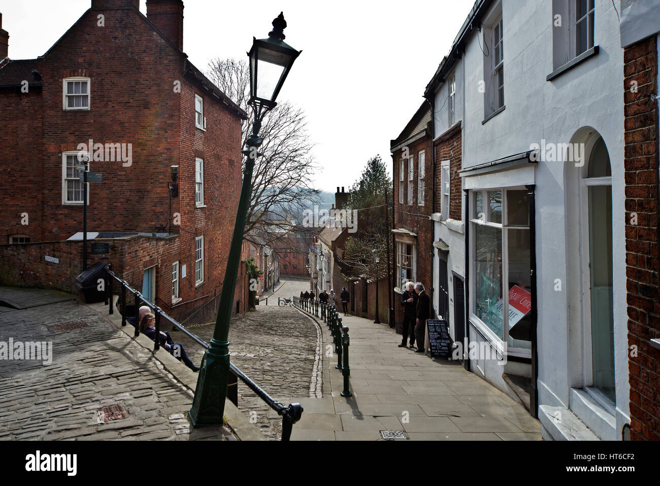 Old Leaning Lampost on the corner of the street on Steep Hill in Lincoln Stock Photo
