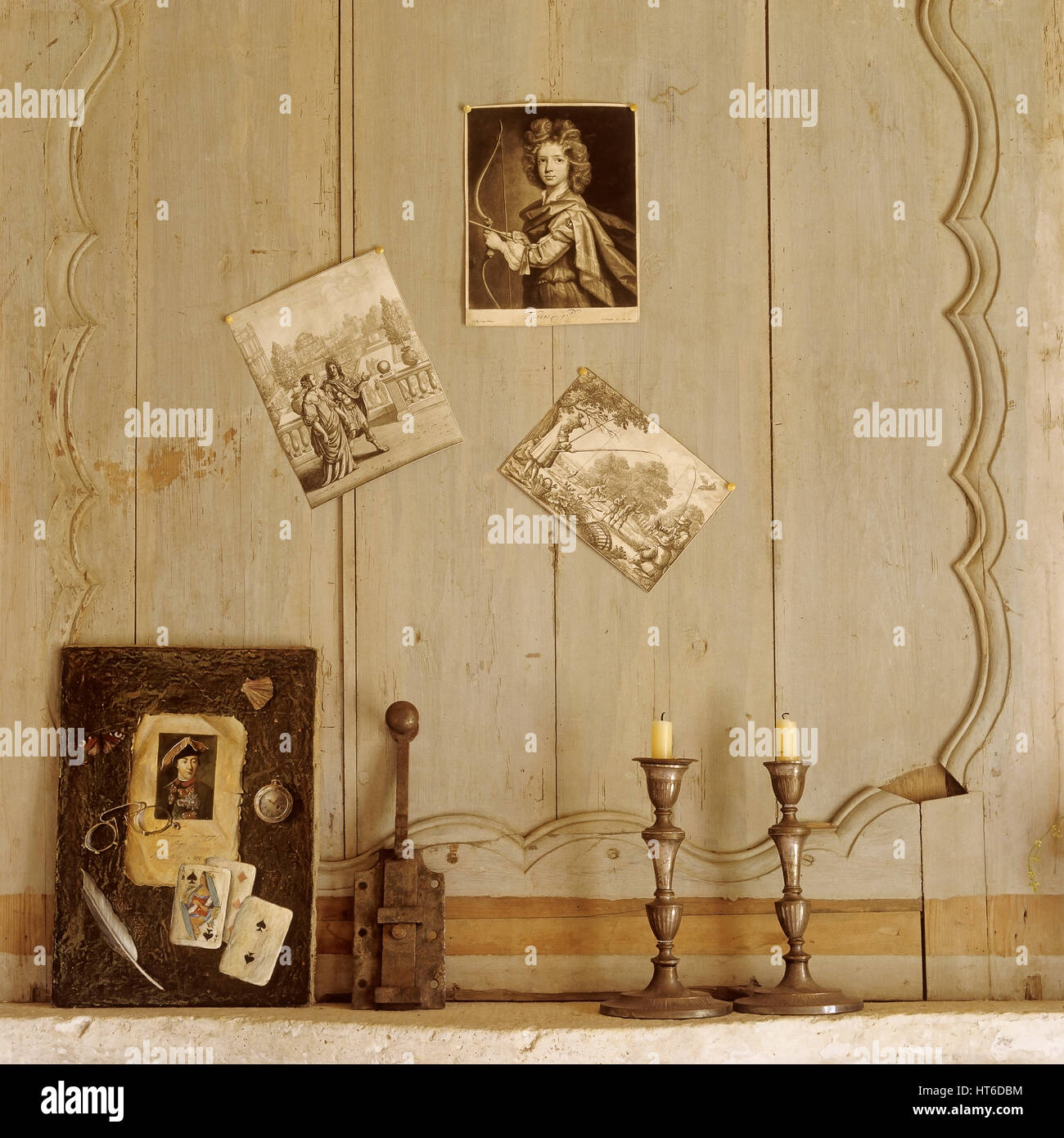 Candlesticks and painting below photographs. Stock Photo