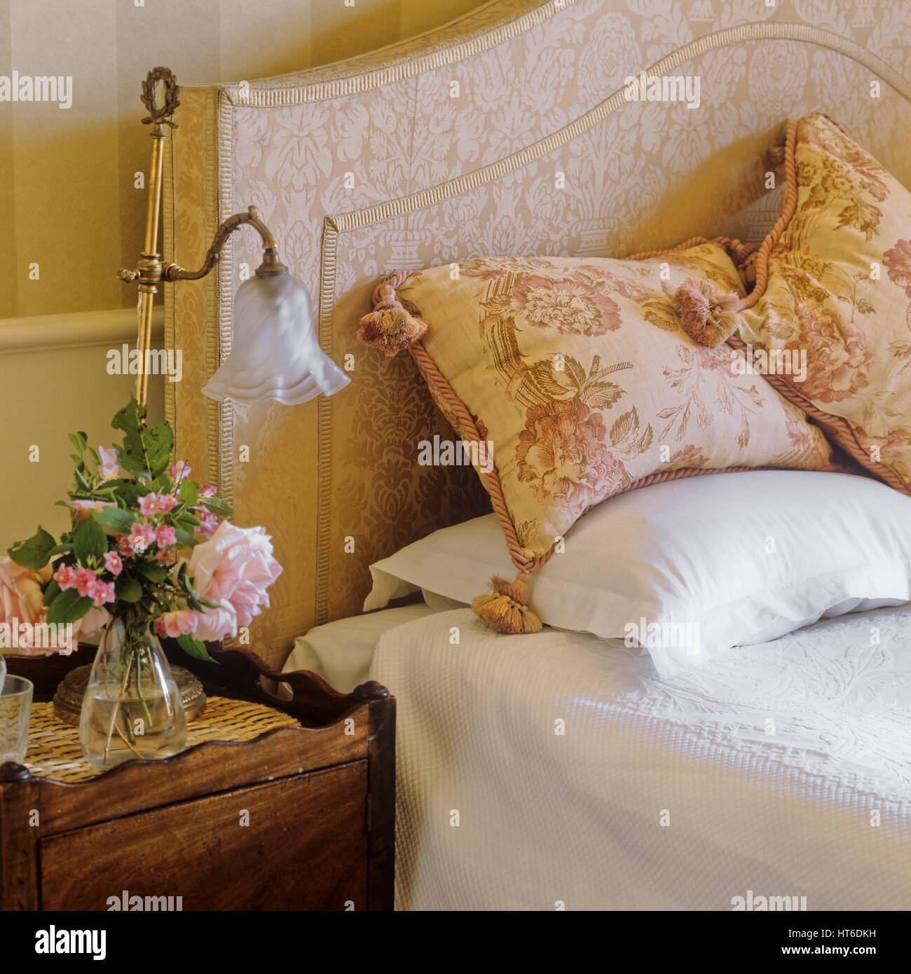 Bedside table with flowers Stock Photo Alamy
