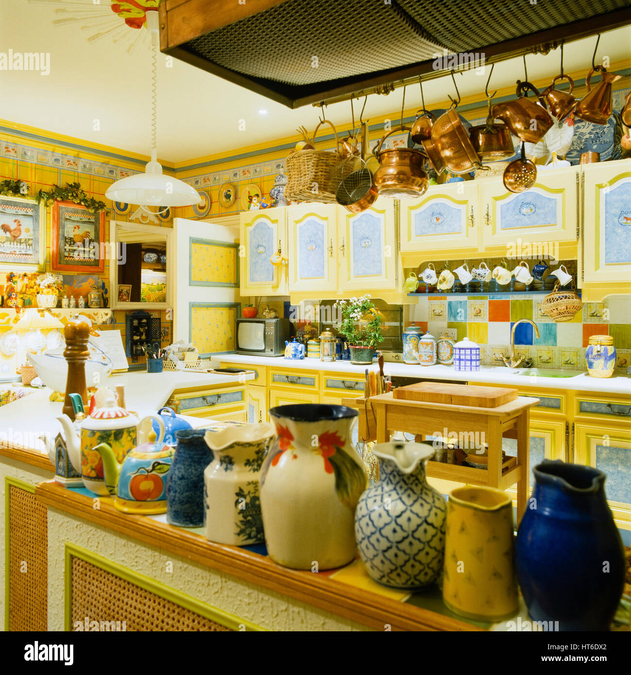 Retro style yellow kitchen. Stock Photo