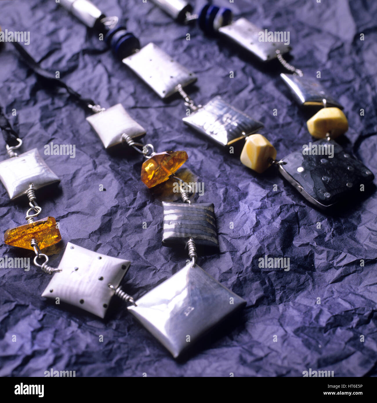 Two necklaces with silver squares. Stock Photo