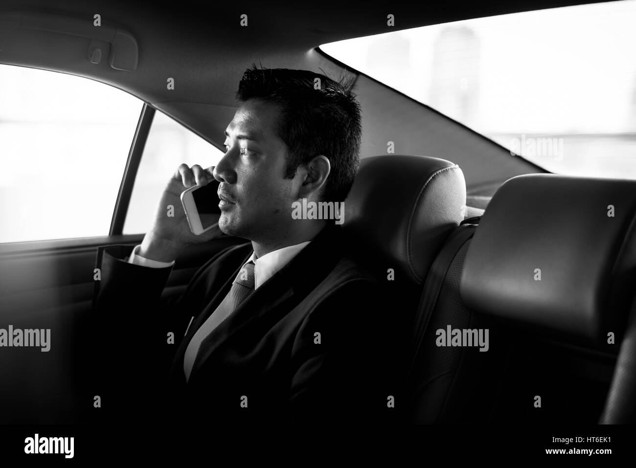 Businessman Sit Inside Car Use Mobile Stock Photo