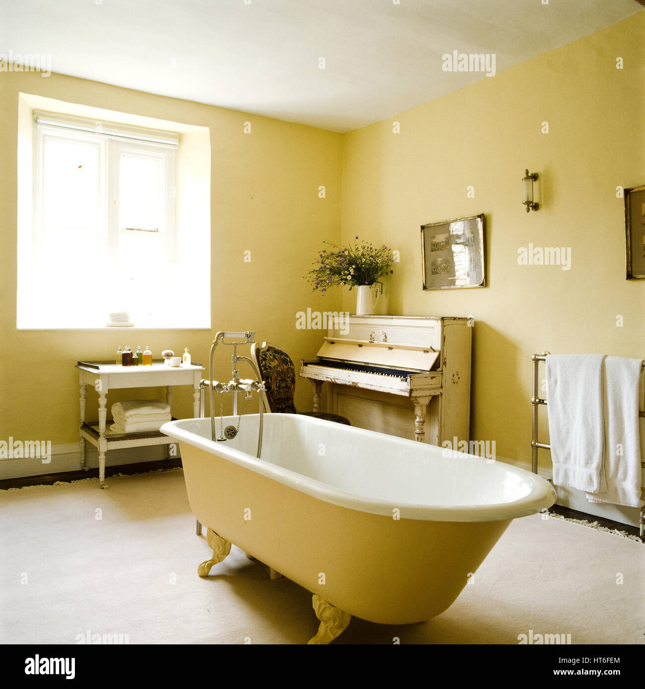 Bathroom with bathtub and piano. Stock Photo