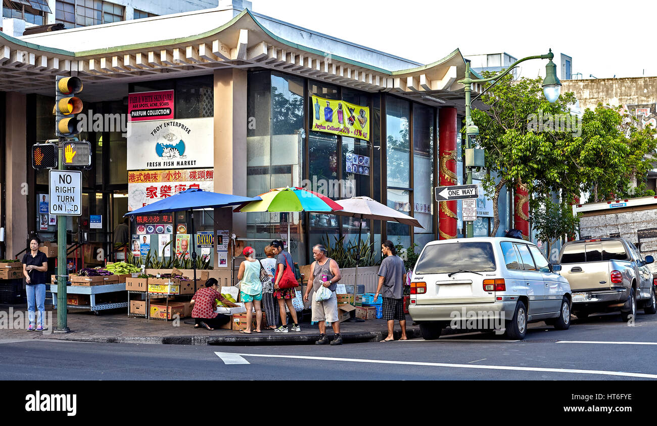 Honolulu, Hawaii, USA - August 6, 2016: Tourists and locals shop and sightsee in the Chinatown Historic District Stock Photo