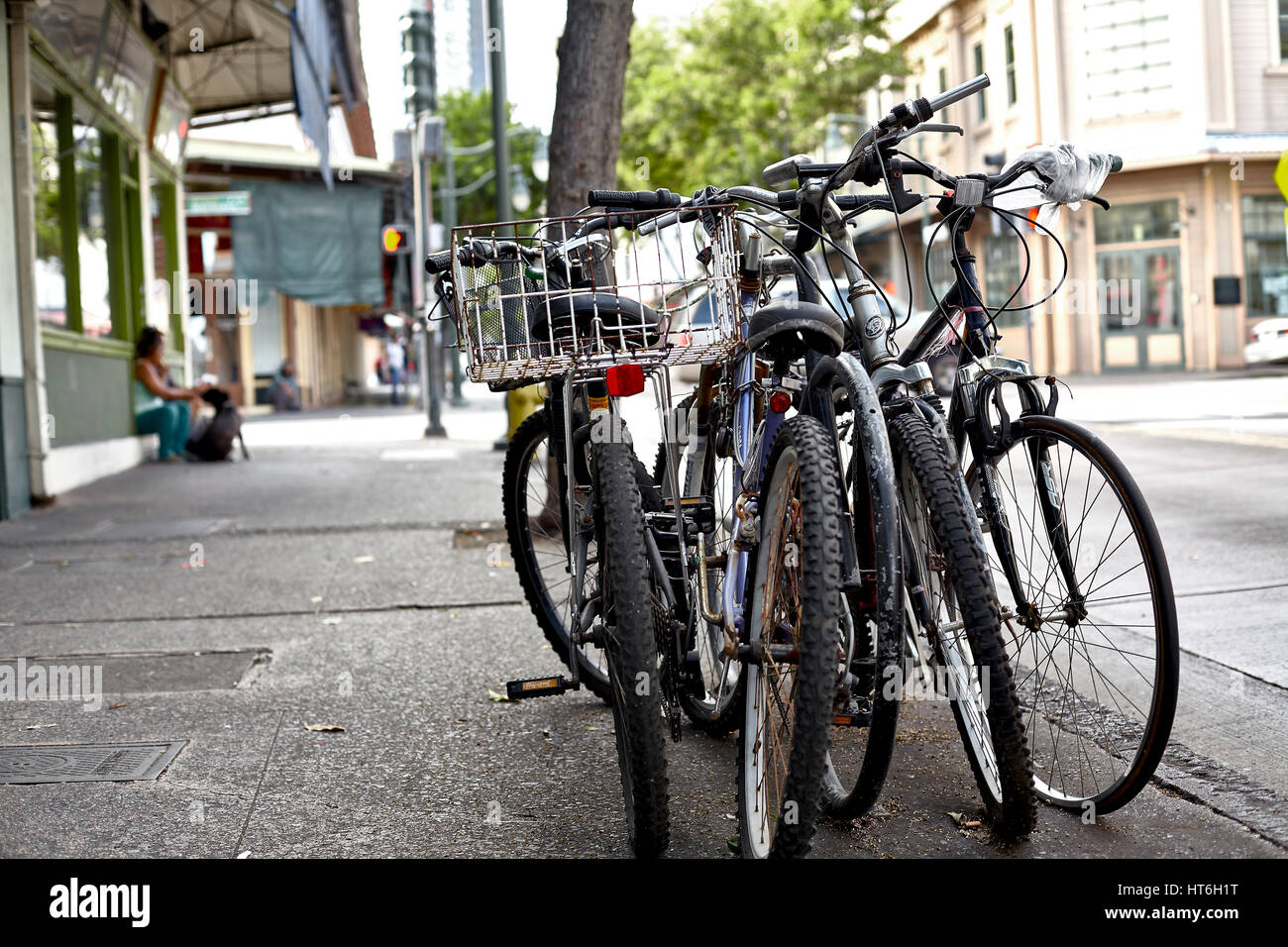 Honolulu; Hawaii; USA - August 6; 2016: Bicycles on sidewalk in Chinatown Historic District; a popular local destination and tourist attraction. Stock Photo