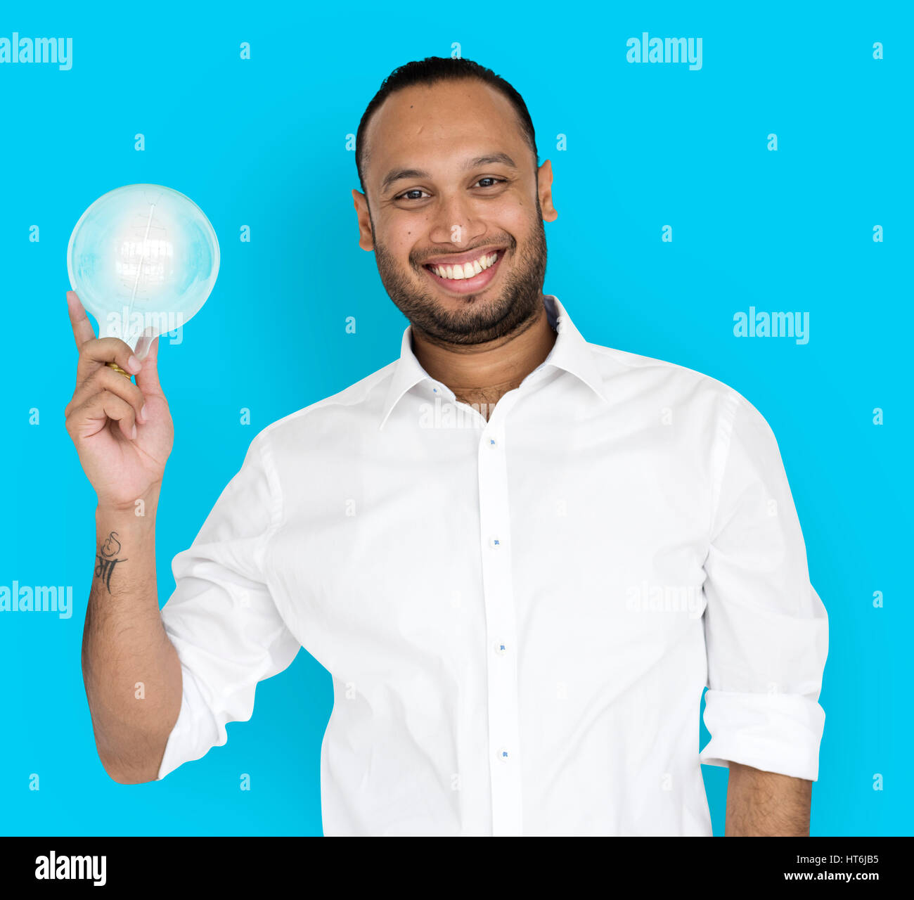 Indian Business Man Smiling Light Bulb Stock Photo Alamy indian-business-man-smiling-light-bulb-stock-photo-alamy
