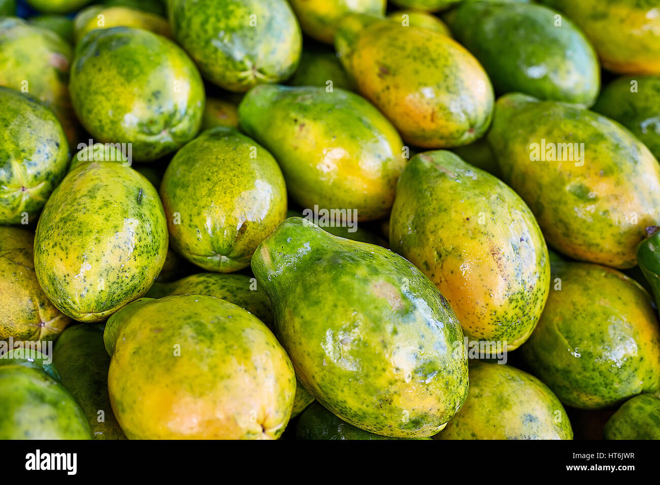 Tropical Hawaiian papaya fruit at farmers market closeup detail Stock Photo