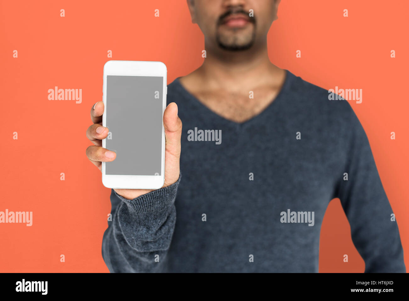 African Descent Man Holding Phone Stock Photo