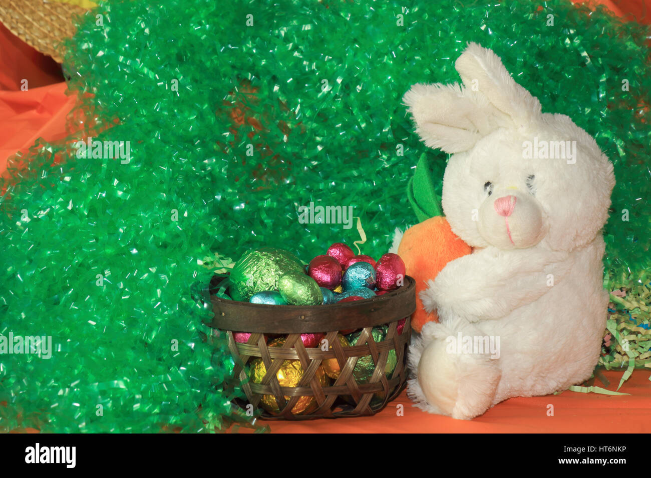 An image showing the concept of Easter with a pot full of eggs and a white bunny Stock Photo