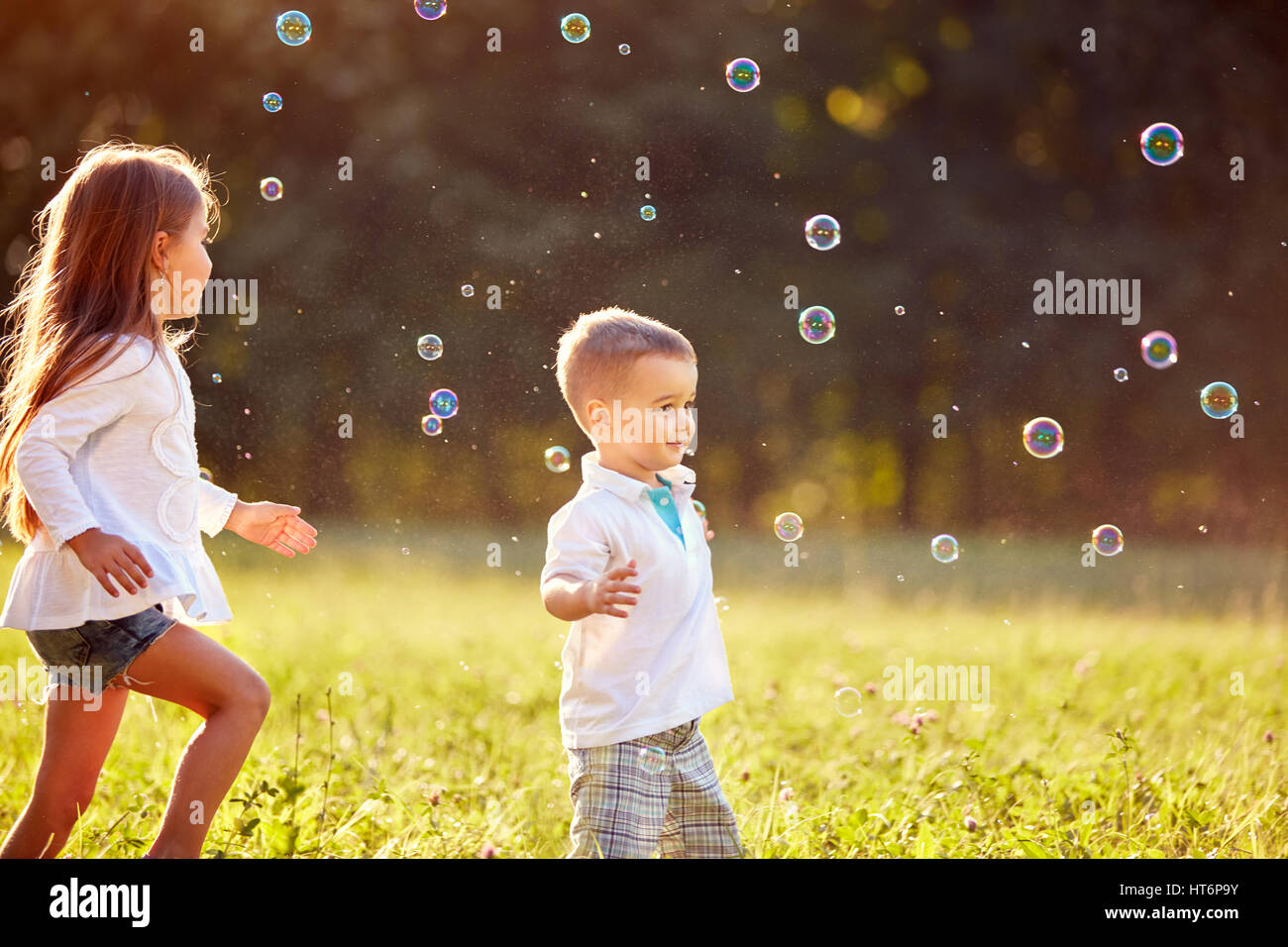 Children with soap bubbles in nature Stock Photo - Alamy