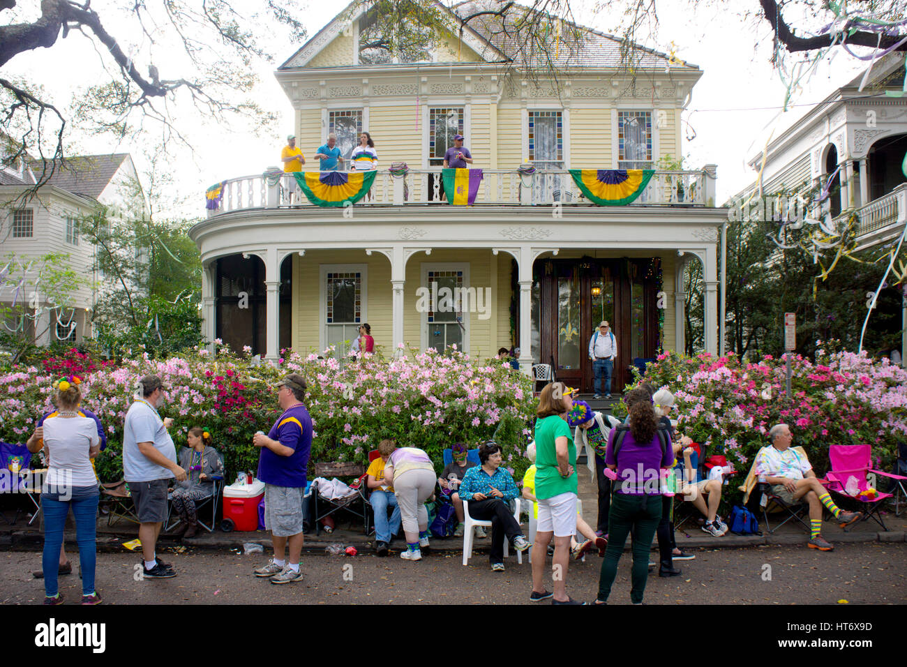 A Mardi Gras crowd gathers on St. Charles Ave waiting for a parade.  New Orleans, LA. Stock Photo