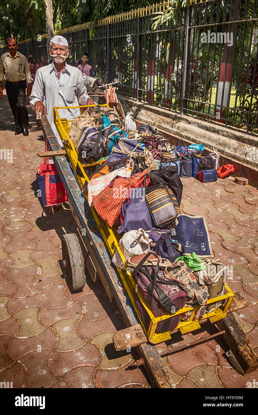 MUMBAI, INDIA - NOVEMBER 10, 2016: In Mumbai, a well-known logistics system delivers lunches through the streets. A dabbawala, or lunchbox delivery wo Stock Photo