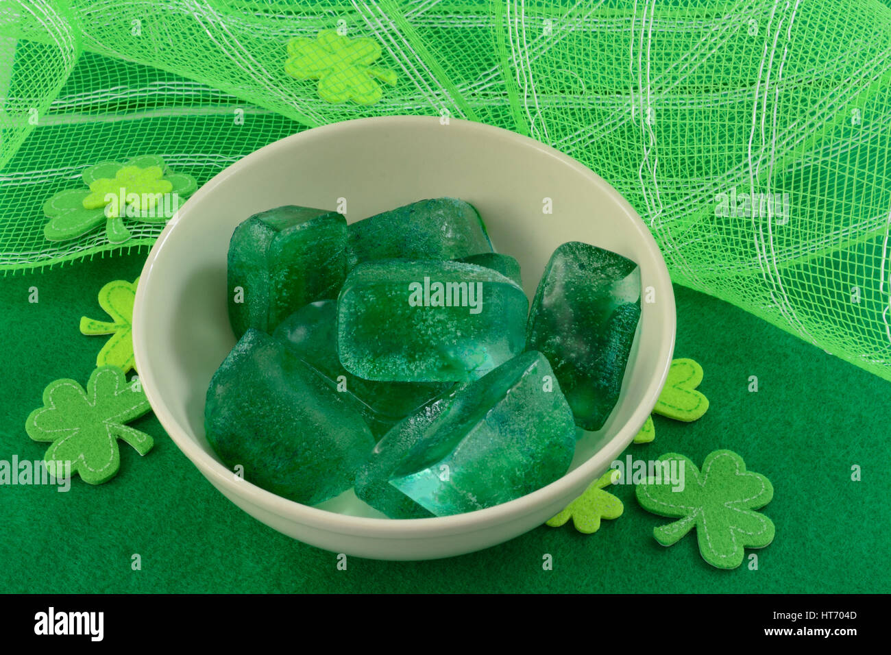 Green ice cubes with green shamrocks for Saint Patrick's Day Stock Photo