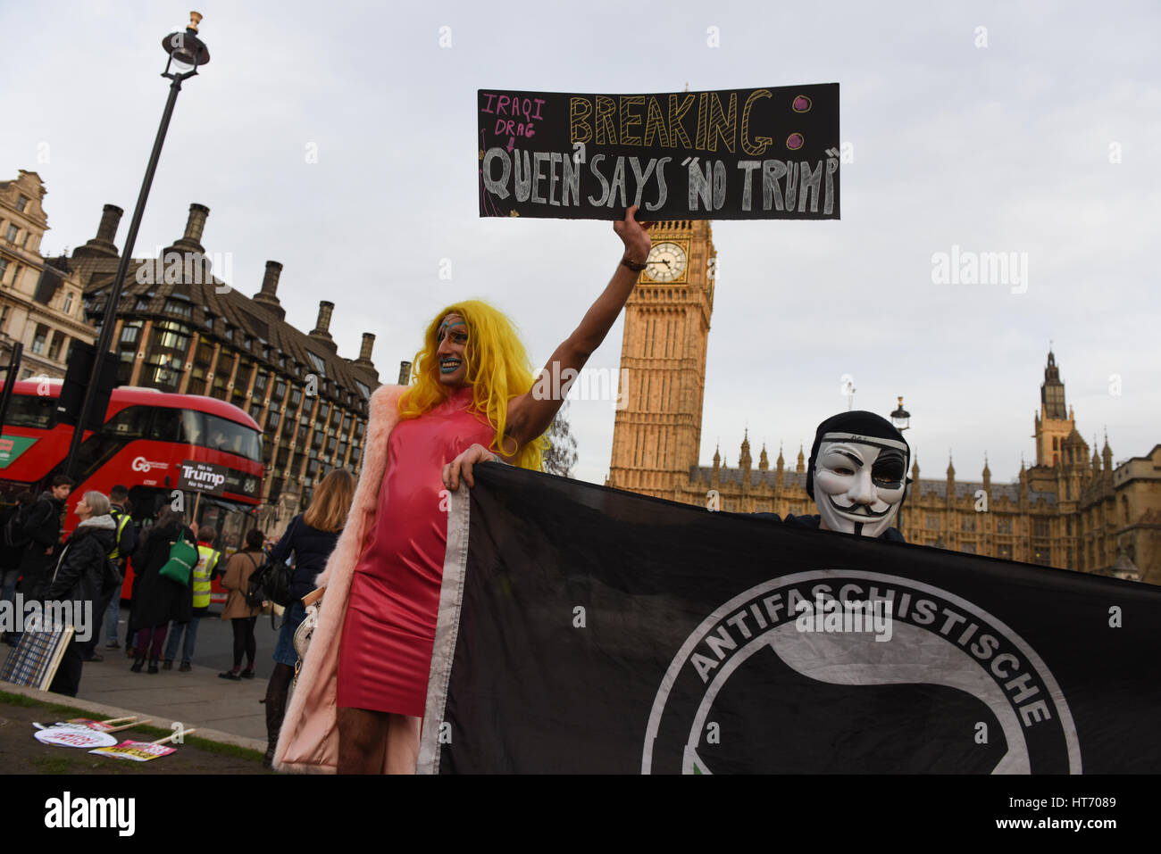 Drag Queen and an anonymous member of the Antifaschistische Aktion join Stop Trump demonstration in Parliament Square, London. Stock Photo