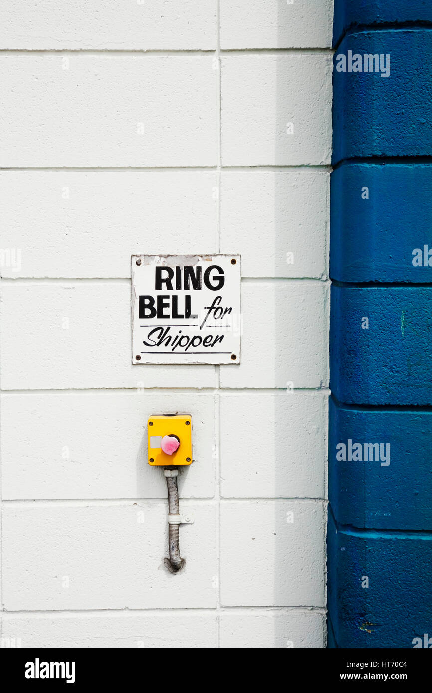 Ring for service sign outside warehouse Vancouver, BC. Canada Stock Photo