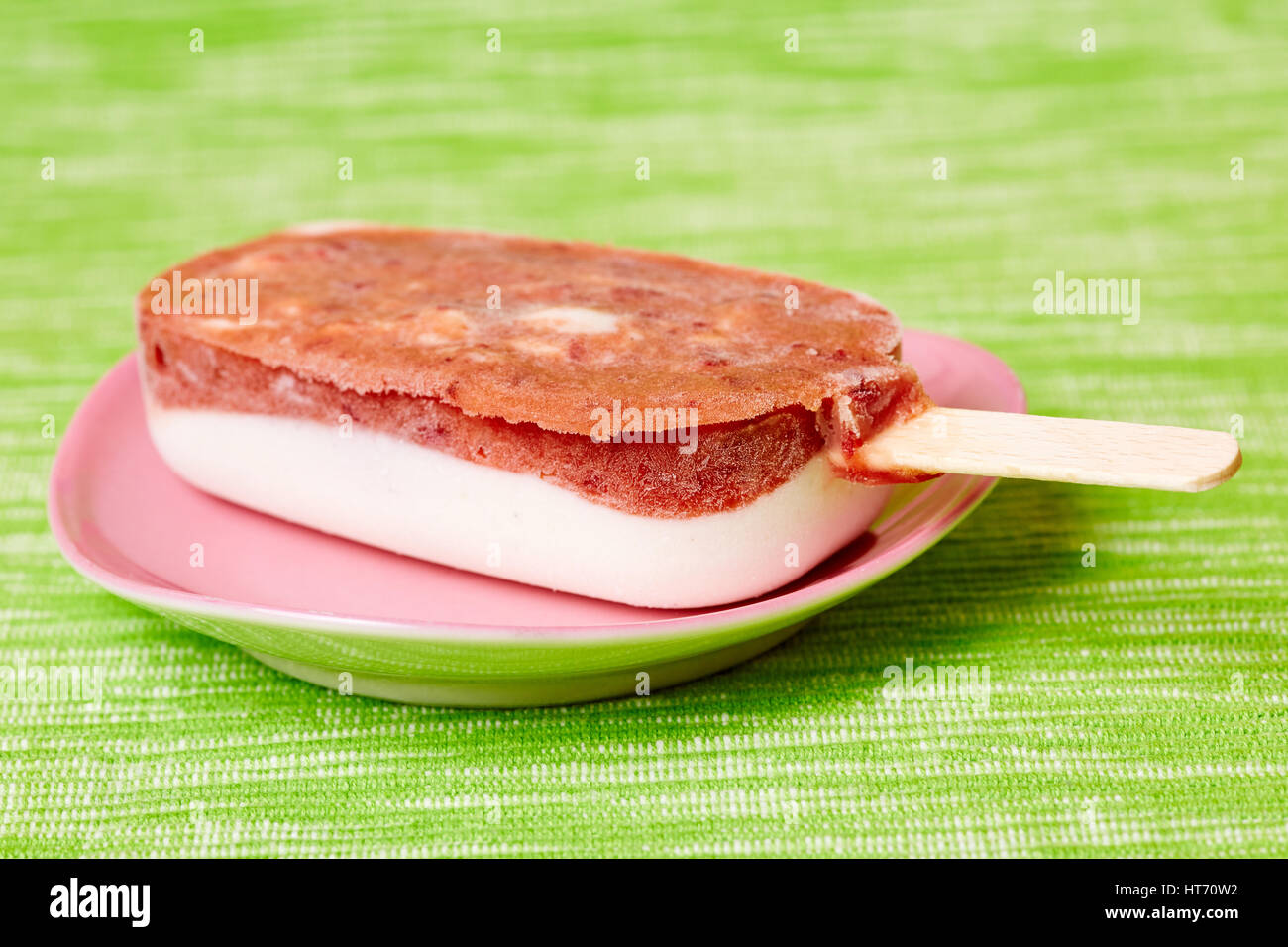Homemade frozen cherry yogurt ice cream popsicle on a stick Stock Photo
