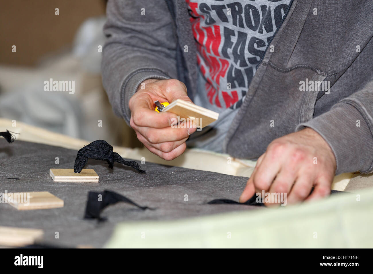 Hand of a man who works with wood products Stock Photo