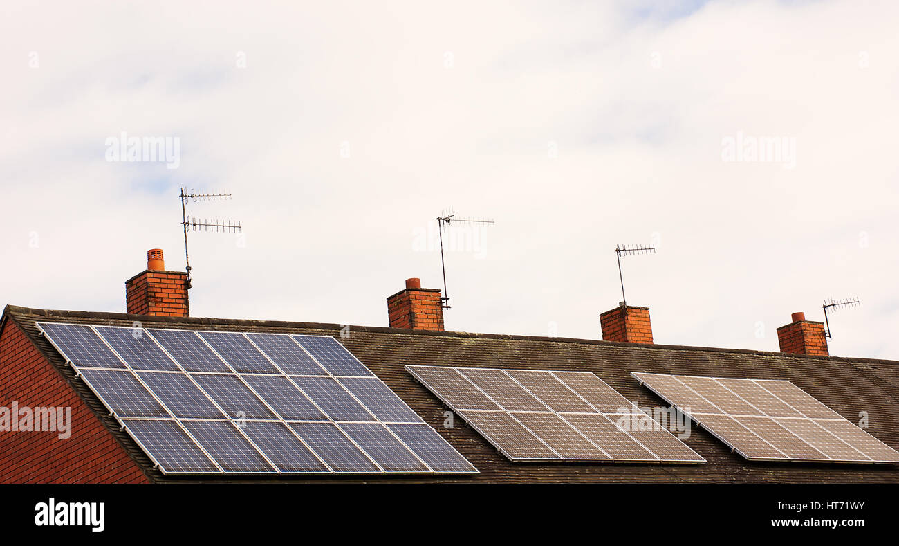 Solar panels on roof top,cloudy sky ,source of renewable energy,Stoke on Trent,Staffordshire,United Kingdom. Stock Photo