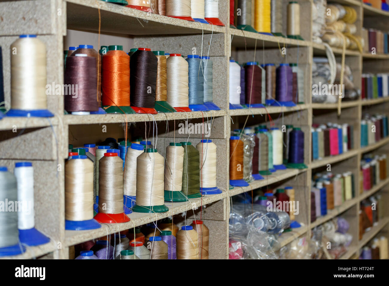 Colored thread on a shelf Stock Photo - Alamy
