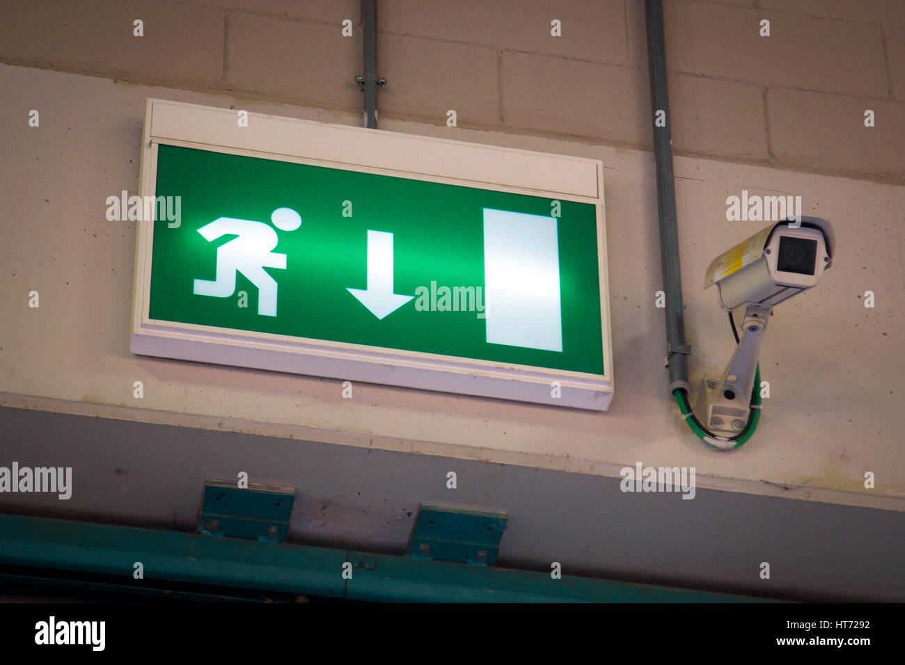 Emergency exit sign above a black doorway Stock Photo Alamy