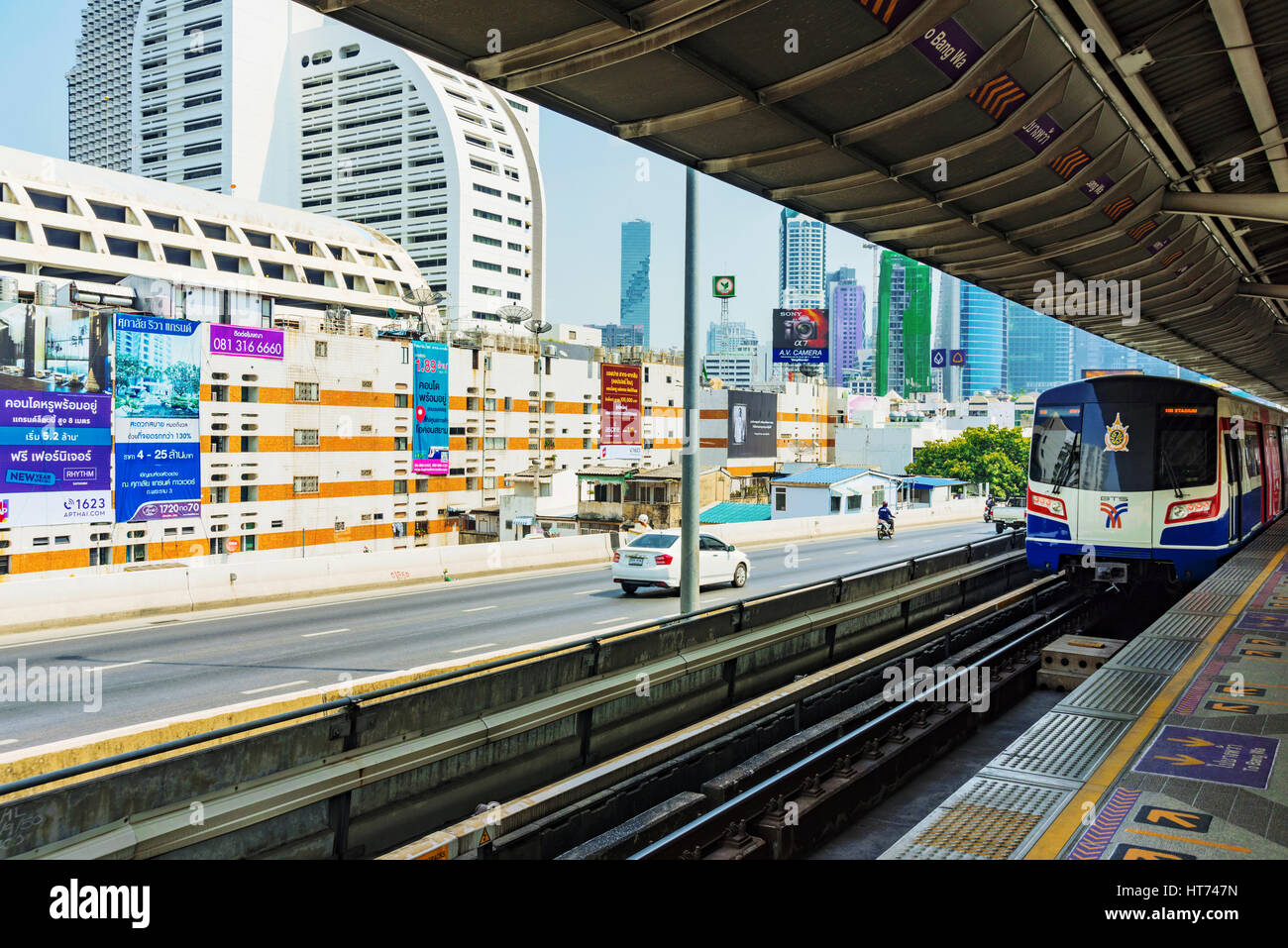 BANGKOK, THAILAND - JANUARY 30: BTS Sky train station platform with a view of downtown Bangkok buildings in the background on January 30, 2017 in Bang Stock Photo