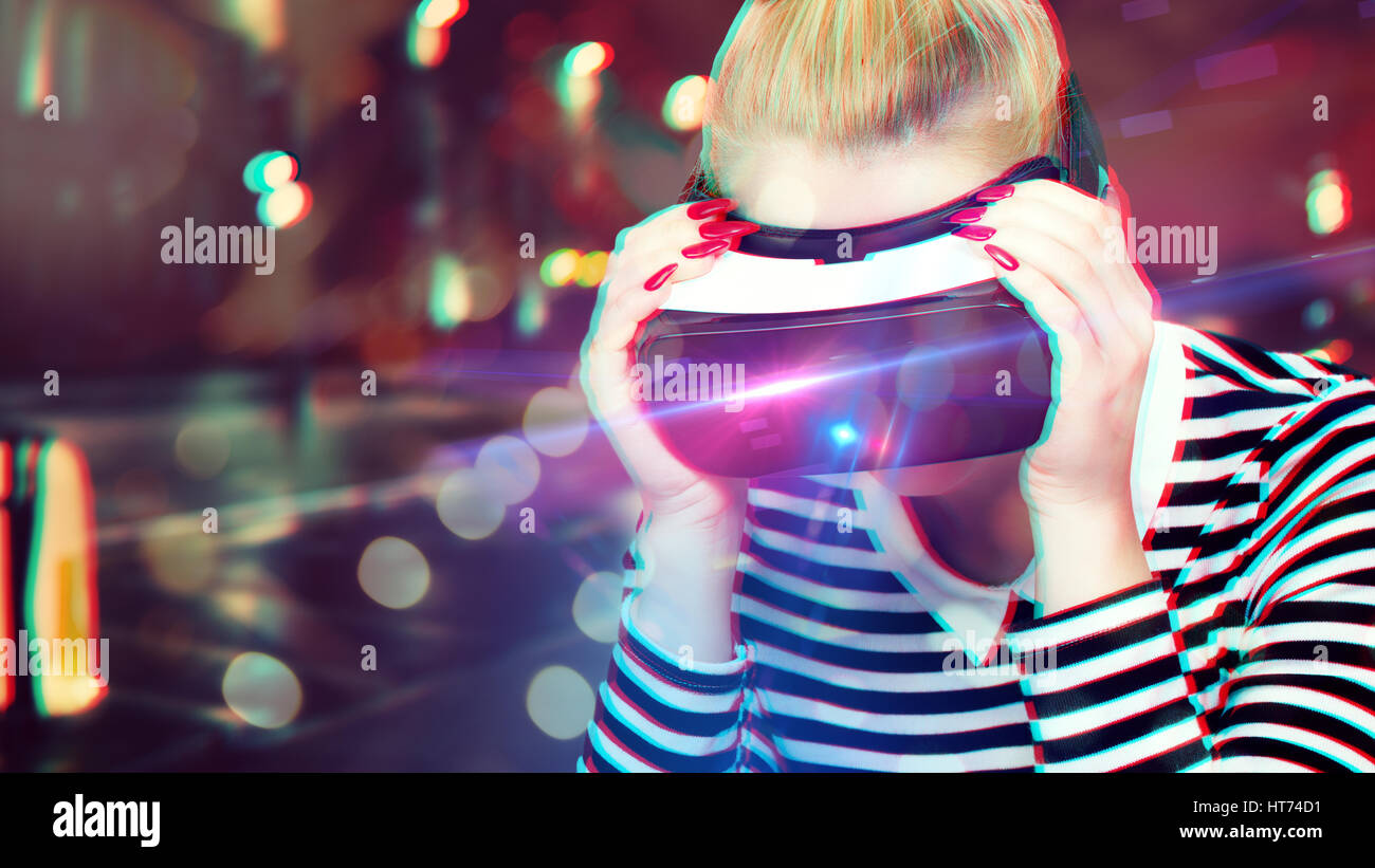 Attractive woman wearing virtual reality glasses. VR headset. Unusual