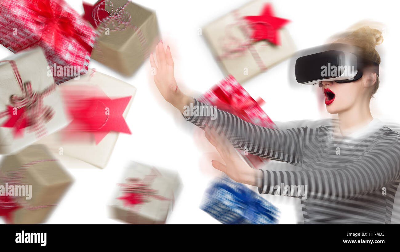 Attractive woman wearing virtual reality glasses. VR headset. Unusual