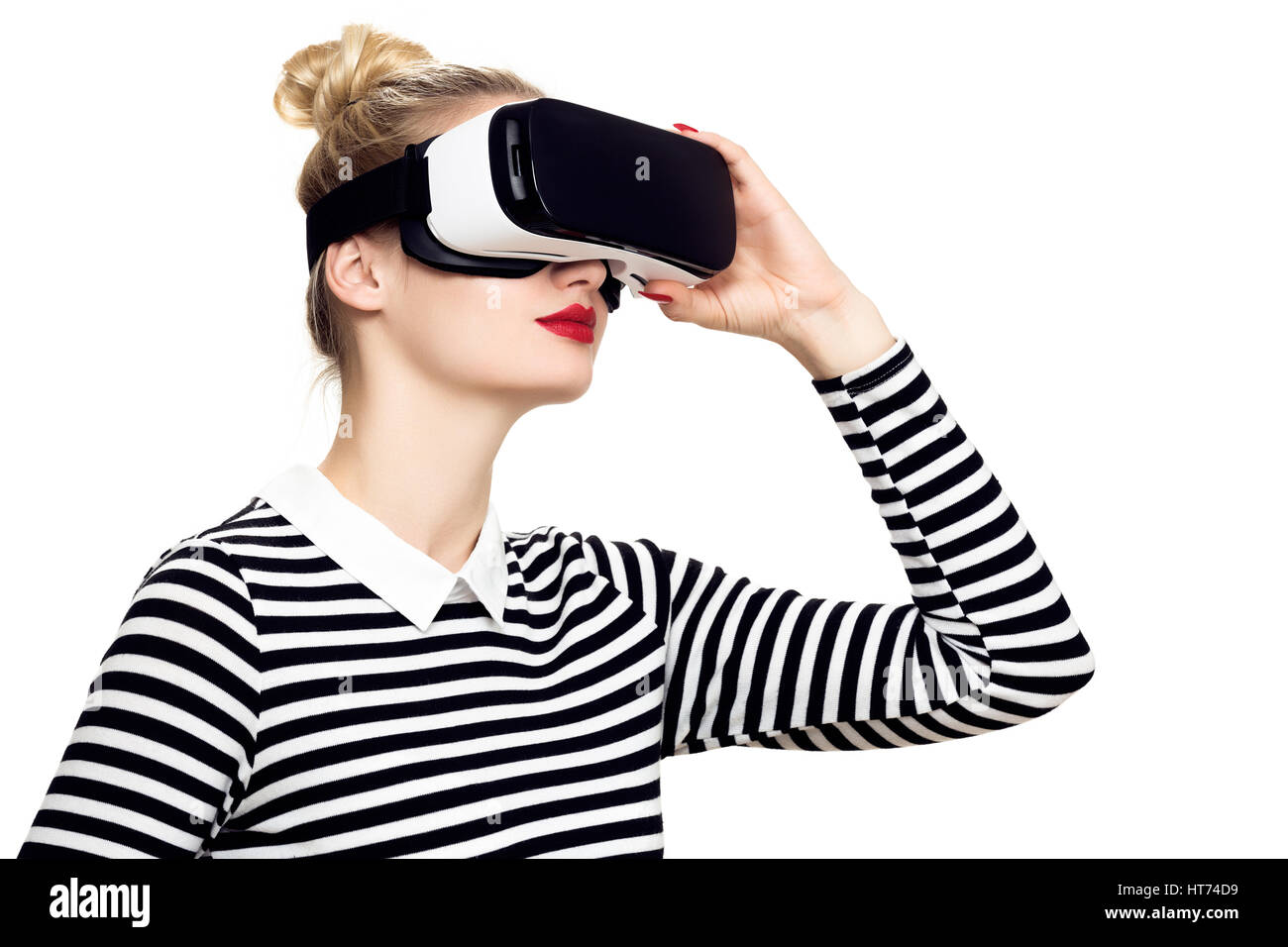 Attractive woman wearing virtual reality glasses. VR headset. Virtual