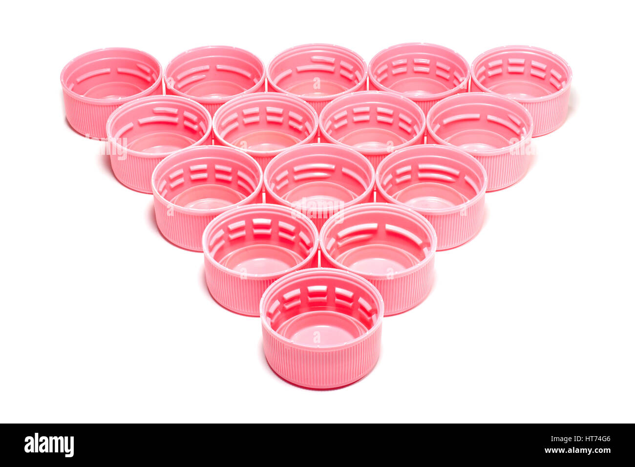Pink plastic bottle caps isolated on white background Stock Photo Alamy