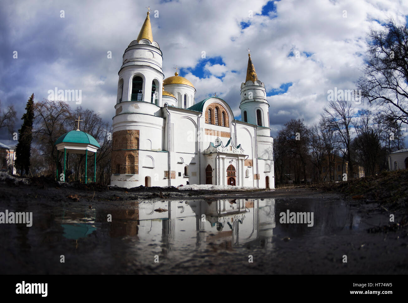 The Transfiguration Cathedral in Chernigiv with reflection, sunny spring day, cloudy sky, March, Ukraine Stock Photo