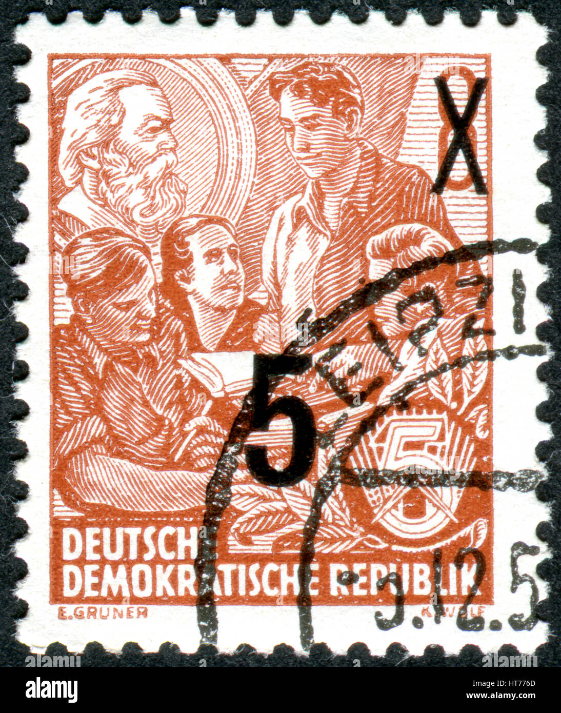GERMANY - CIRCA 1953: A stamp printed in Germany (GDR), is dedicated to the five-year plan, shows a study of Marxism, circa 1953 Stock Photo