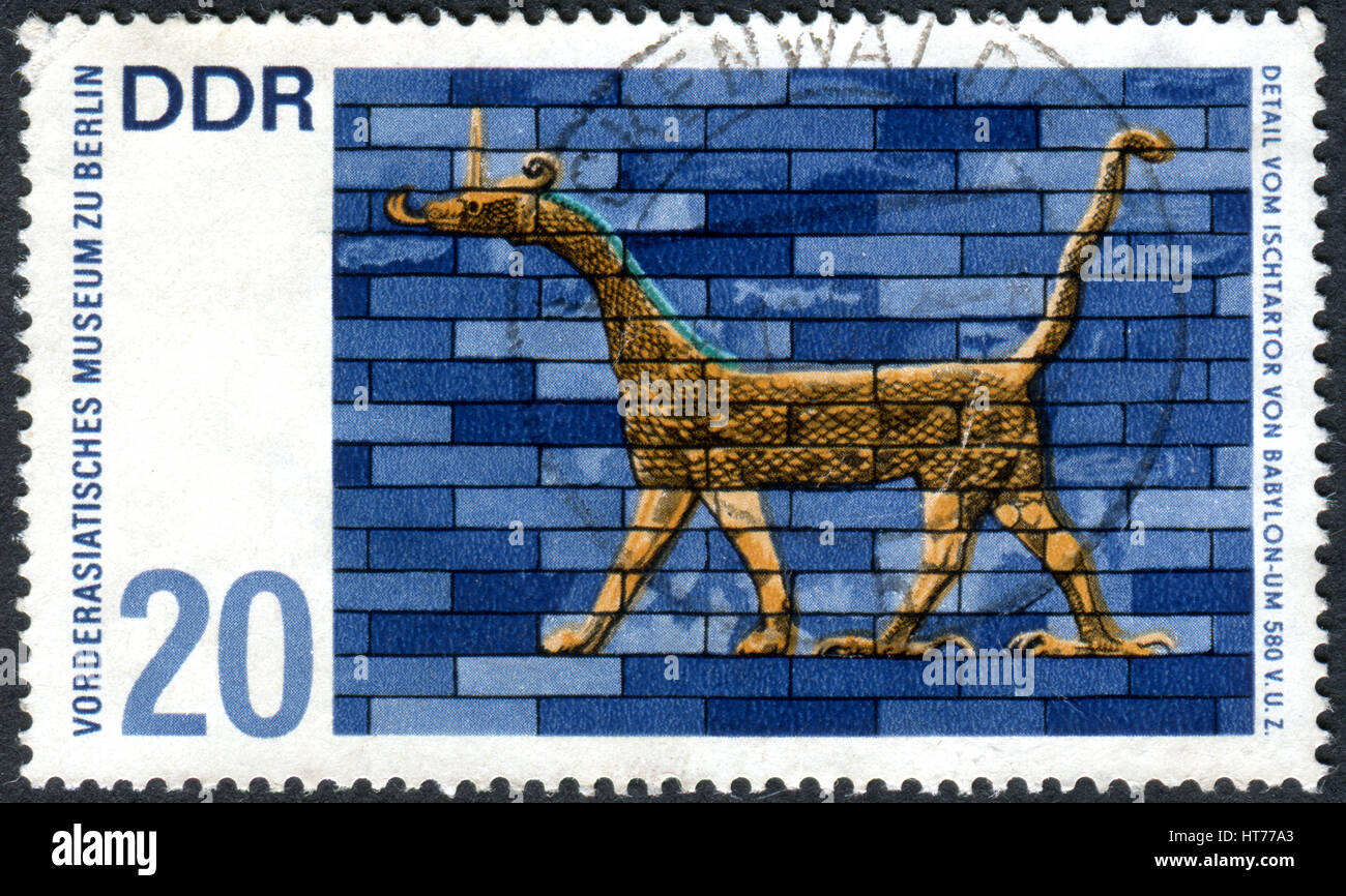 A stamp printed in Germany (GDR), shows the detail from Ishtar Gate, Babylon. Artwork from Near Eastern Museum, Berlin Stock Photo