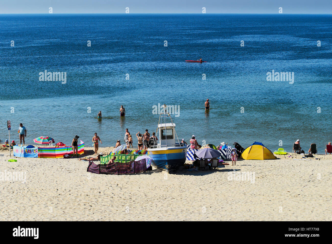 Summer Baltic sea beach with sunbathers on June 24, 2016 in Stegna, Pomerania, Poland. Summer recreation at the seaside. Stock Photo
