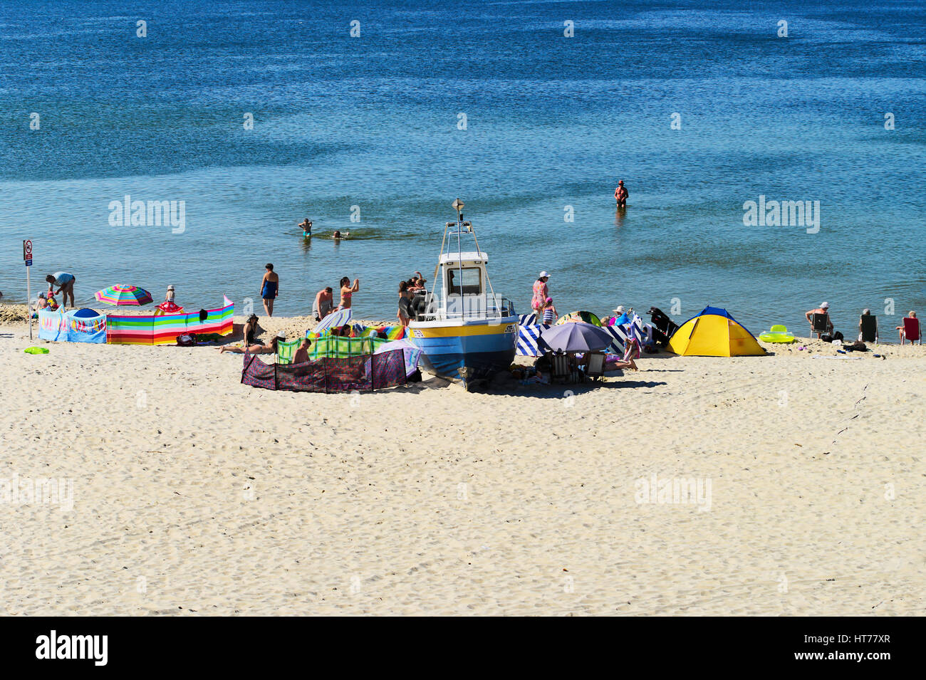 Summer Baltic sea beach with sunbathers on June 24, 2016 in Stegna, Pomerania, Poland. Summer recreation at the seaside. Stock Photo
