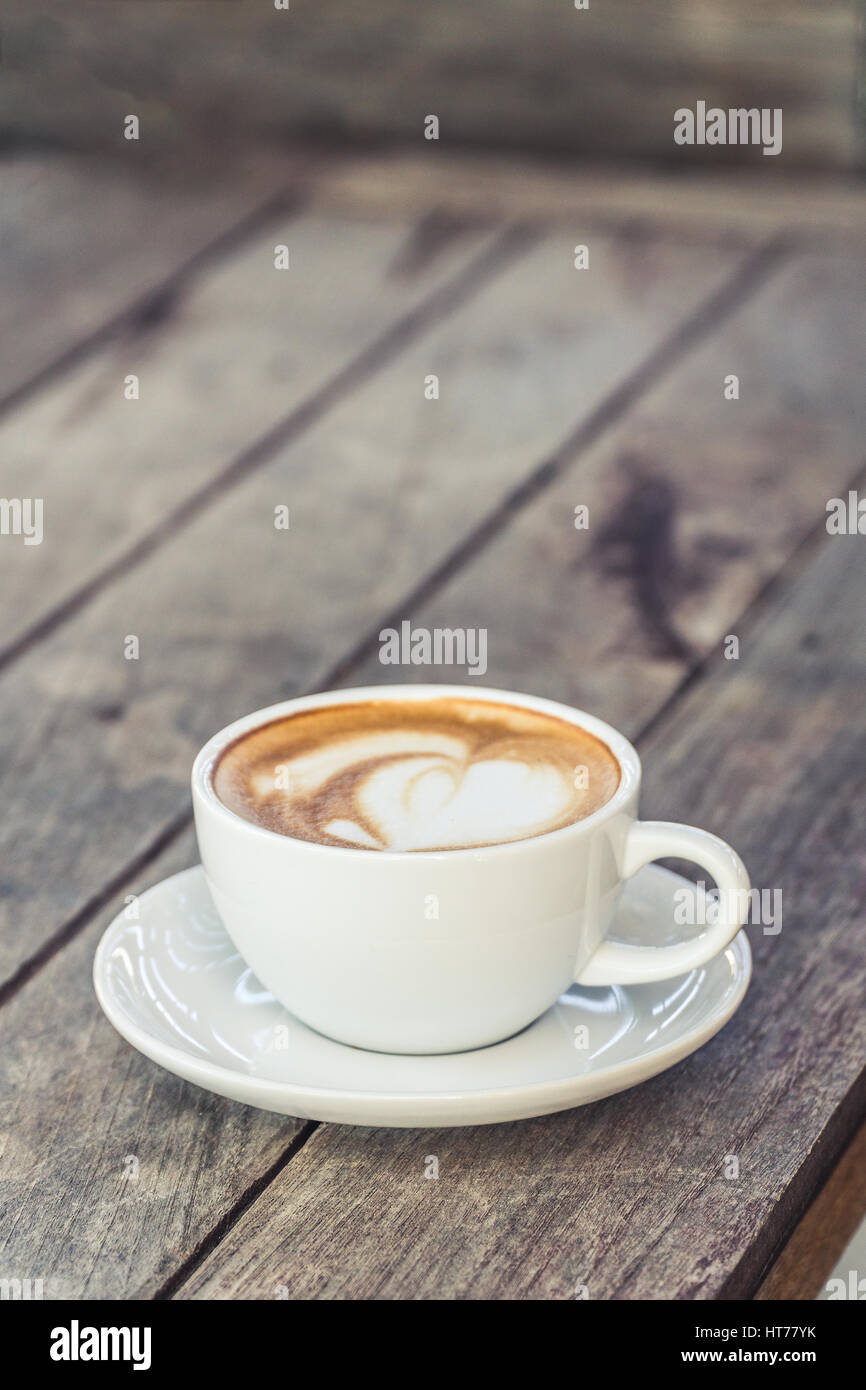 Hot coffee cup on wood table decorative,Working and meeting concept