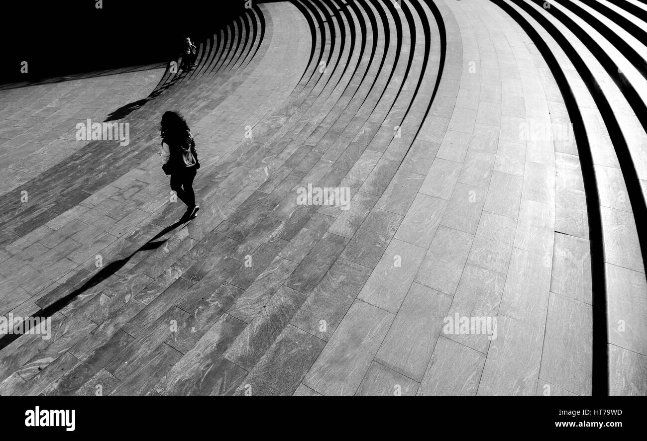 Young woman stairs in the city square, Shanghai, China Lujiazui. Stock Photo