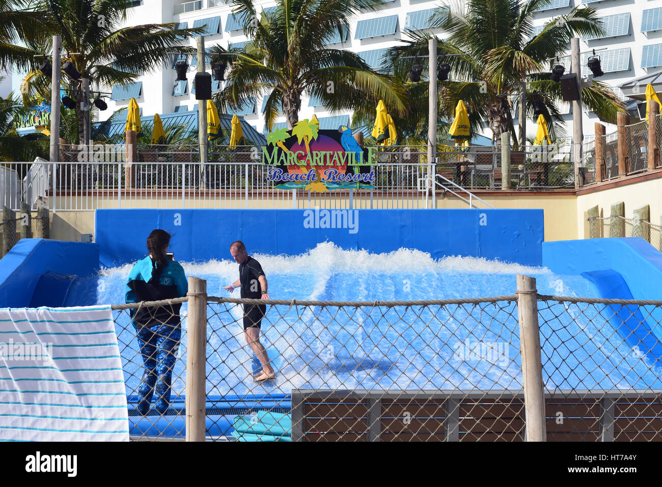 Hollywood Beach, FL, USA - March 5, 2017: People enjoy the FlowRider surf simulator the Margaritaville Beach Resort.  Margaritaville is a popular chai Stock Photo
