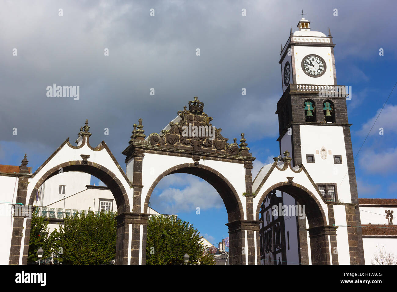 Portas da Cidade Gates and Saint Sabastian church with clock tower ...