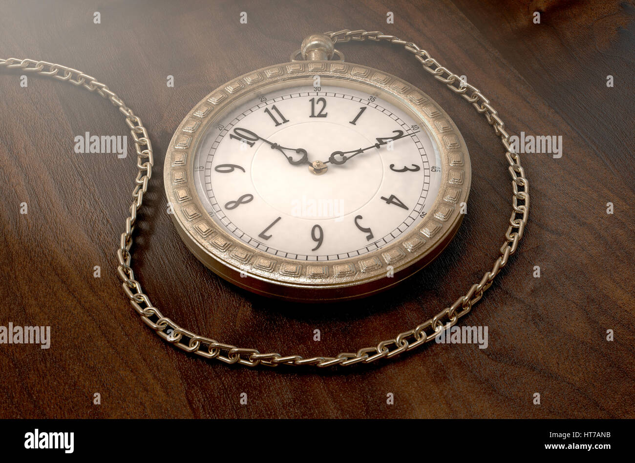 A closeup of an intricate gold antique pocket watch attached to a chain on a wooden surface background - 3D render Stock Photo