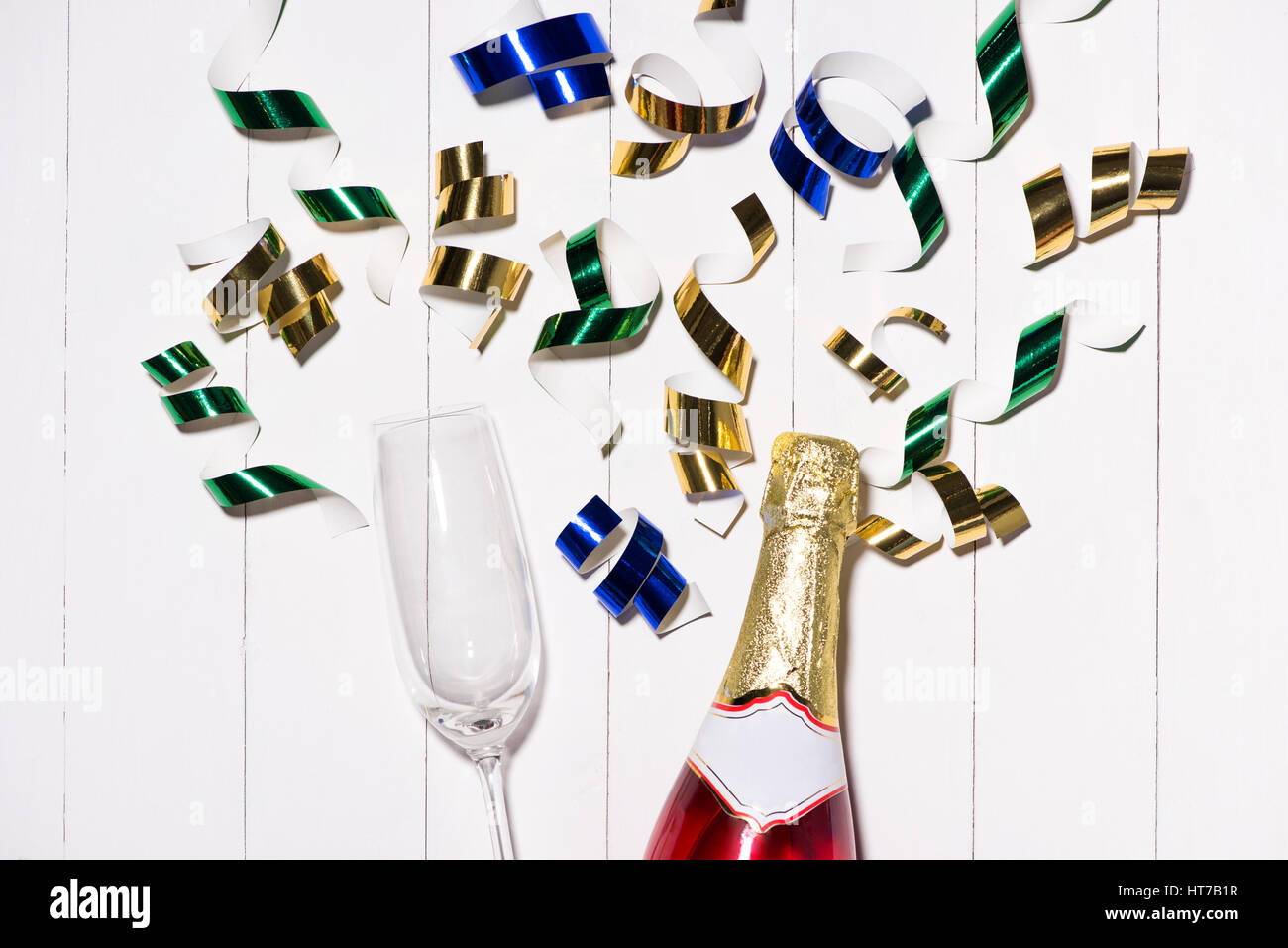 Celebration Flat lay. Champagne bottle with copyspace on wooden background Stock Photo