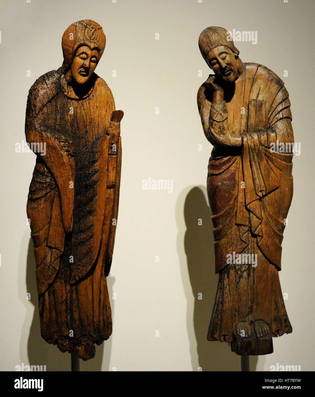 Descent from the Cross. Figures of Virgin Mary and Saint John the Evangelist. Second half of 12th century. Wood. From Parish Church of Saint Eulalia of Erill la Vall (Boi Valley, Catalonia). National Art Museum of Catalonia. Barcelona. Catalonia. Spain. Stock Photo