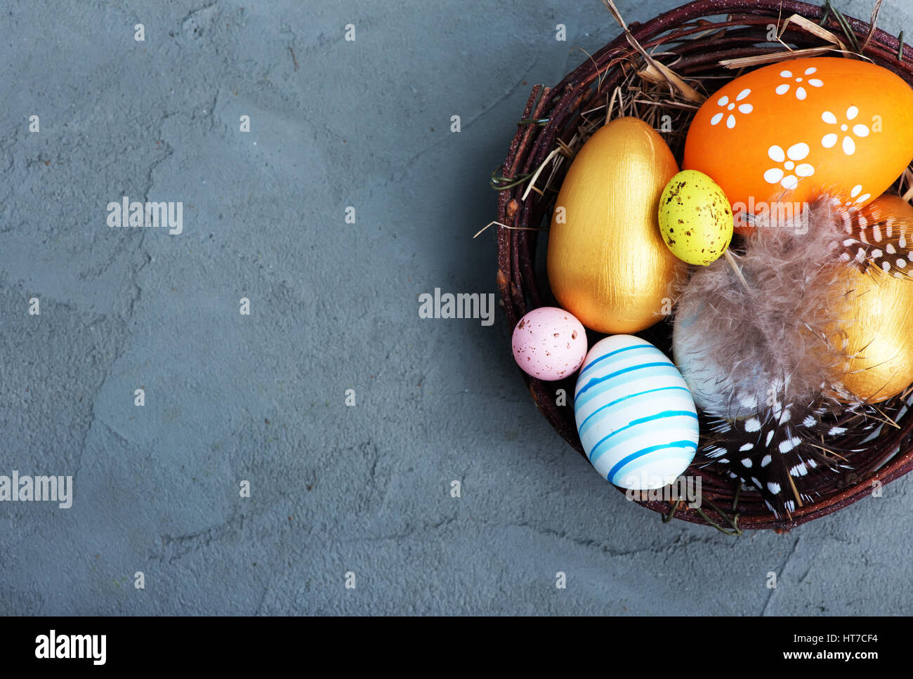 color easter eggs on the table, easter background Stock Photo